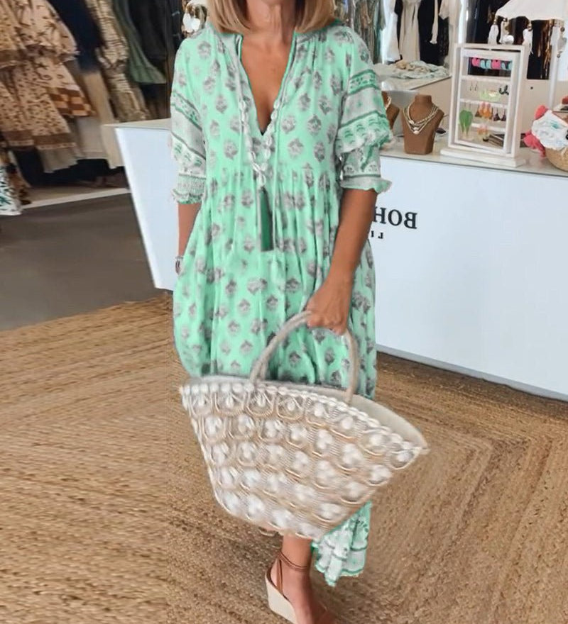 MANA | MIDI-JURK MET FLORELE PATROON EN V-HALS